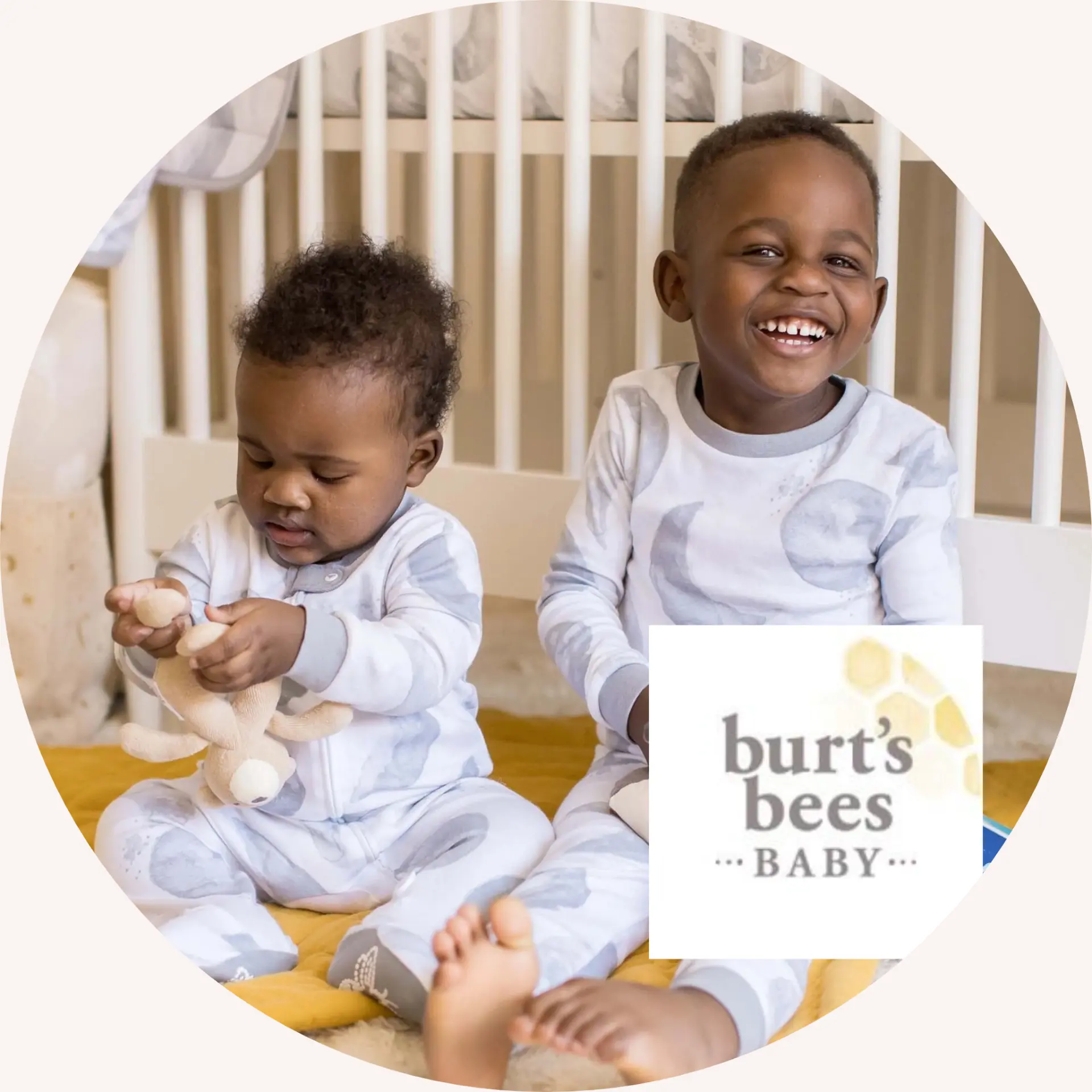 Two children wearing Burt's Bees Baby apparel pajamas